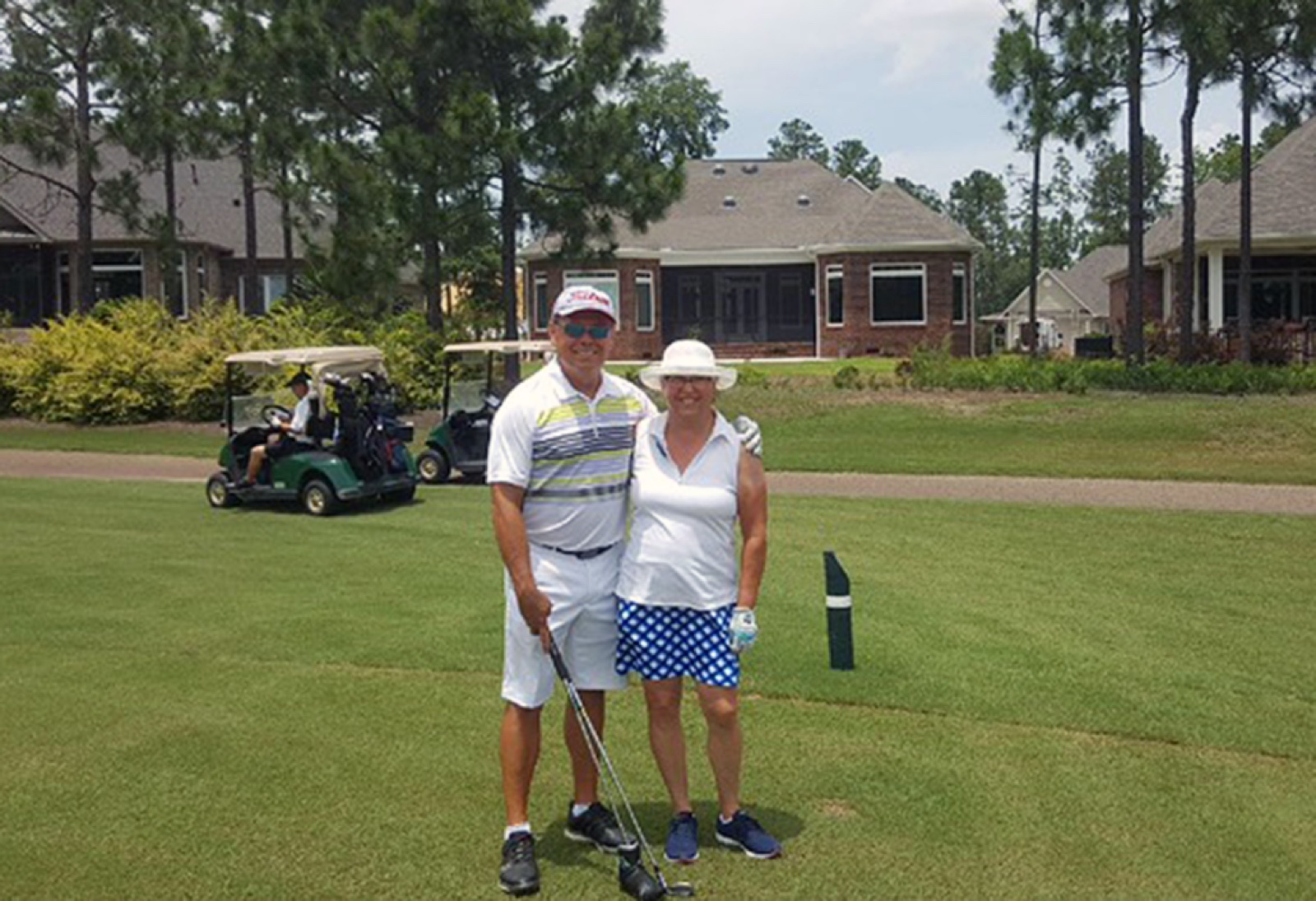 Allen and Clare on the course in front of their home in Aiken