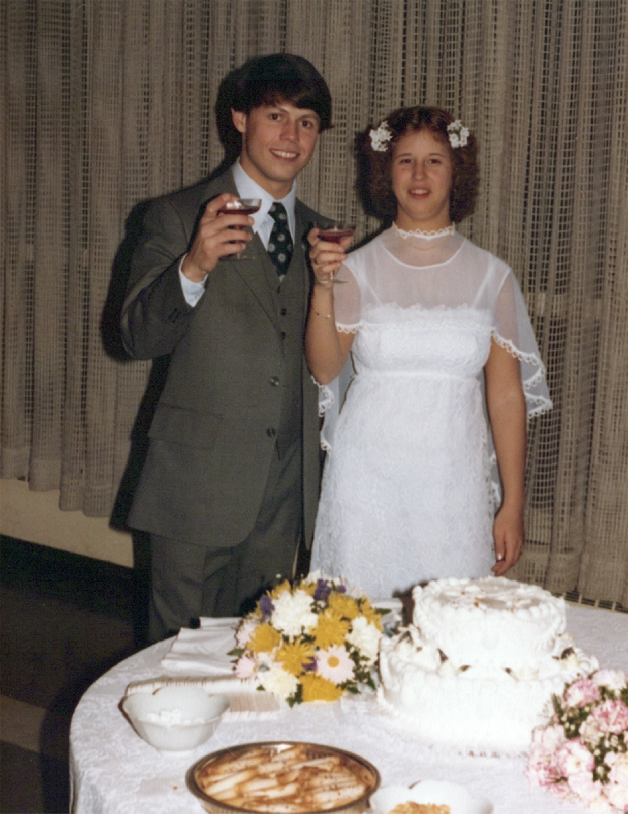 Allen and Clare toasting at their wedding